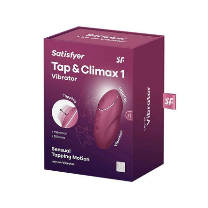 Tap and Climax 1 Vibrator and tapping Red ergonomic design with box packaging featuring dual-action motors for targeted stimulation.
