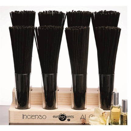 Tentation Incense Maxisticks with Pheromone 100 unt Fruit of Passion on display in glass holders with essential oils nearby.