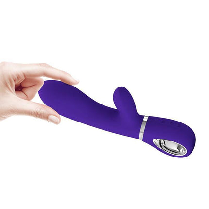 Thomas Vibrator G-Spot Purple with dual stimulation and 7 vibration modes in hand, featuring premium silicone and ergonomic design.