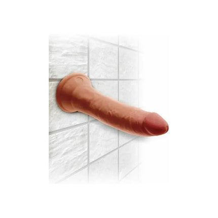 Triple Density Dildo 7 Caramel with suction cup on tile wall, lifelike feel by King Cock Plus