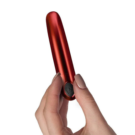 Truly Yours Vibrating Bullet Ruby Caress Metallic Red held in hand for precise stimulation and luxurious sensation.