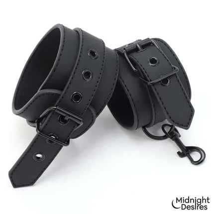 Close-up of Under Mattress Set with Wrist & Ankle Cuffs Cl.24 in black leather.