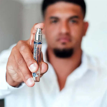 Man holding unscented pheromones For Him 10 ml bottle, highlighting its subtle appeal and compatibility with any fragrance.