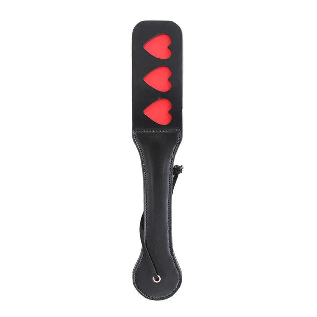 Vegan Leather Paddle with Hearts 32 cm featuring heart cutouts, perfect for couples seeking a cruelty-free and luxurious experience.