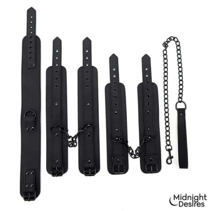 Restraint Set with Collar with Leash and Cuffs featuring vegan leather wrist and ankle cuffs, collar, and chain leash by Midnight Desires.