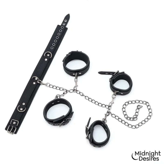 Restriction Set with Collar and Cuffs featuring vegan leather collar, wrist, and ankle cuffs by Midnight Desires for adult restraint play.
