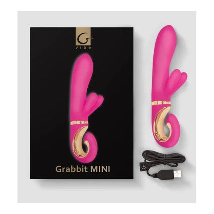 Vibe Grabbit Mini Dolce Violet vibrator with BIOSKIN? material, USB cable, and packaging shown on display.