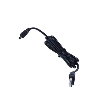 Black coiled electrical power cable with connectors for electronic devices on white background