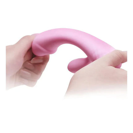 Hands bending Vibe Smart Ron, a dual-motor silicone vibrator, designed for G-spot and clitoral stimulation in intimate moments.