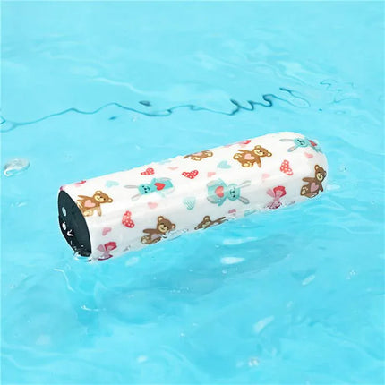 Vibrating Bullet Bear floating in water, showing colorful bear pattern. Compact and portable design for discreet use.