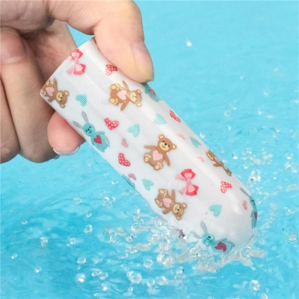 Vibrating Bullet Bear in water, compact design with teddy bear pattern, ideal for travel.