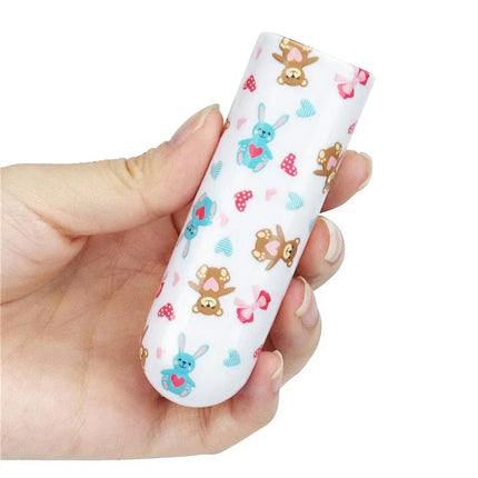 Vibrating Bullet Bear with playful bear design held in hand, compact and portable, USB-rechargeable, body-safe material.