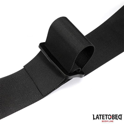 Black waistband and Velcro wrist cuff from Latetobed BDSM line for secure, consensual restraint play.