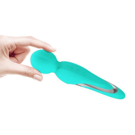 Hand holding Walter Wand Massager Aqua with rounded head for targeted muscle tension relief.