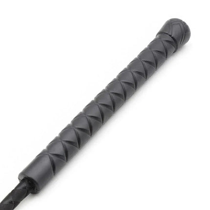 Close-up of the handle of a White Lining Riding Crop featuring a sleek design perfect for BDSM play.
