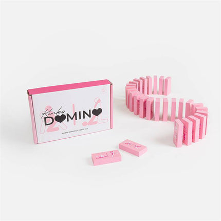 Wooden Game Kinky Domino set with pink wooden pieces and box, designed for adult-themed gameplay.